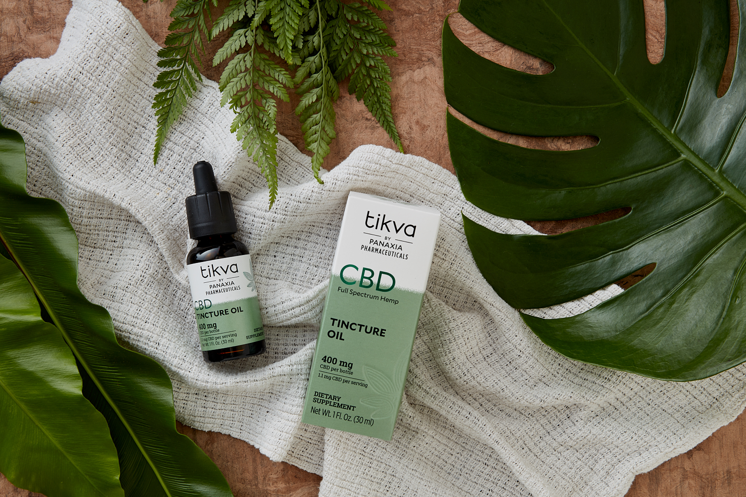 Tikva CBD Tincture Oil with Cloth and Greenery